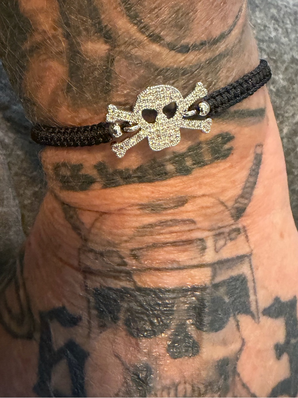 NWT Kohls Silver Plated Pave Skull & Crossbones Adjustable Bracelet w/Black Cord